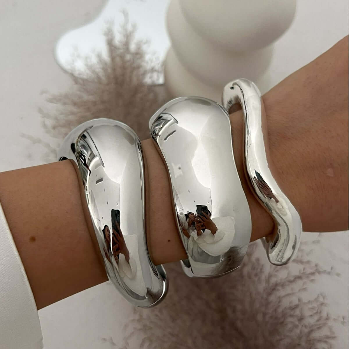 An Open-Ended Design Bracelet Wrape Around the Wrist without a Clasp Creating the Hug Effect