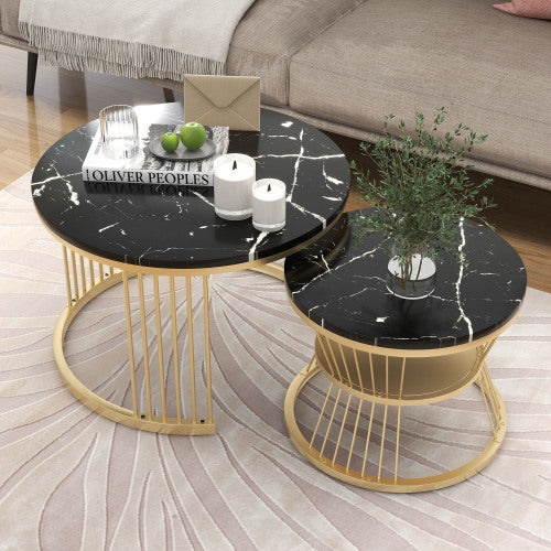 Elegant nesting coffee tables with black marble tops and gold metal frames, perfect for modern living spaces.