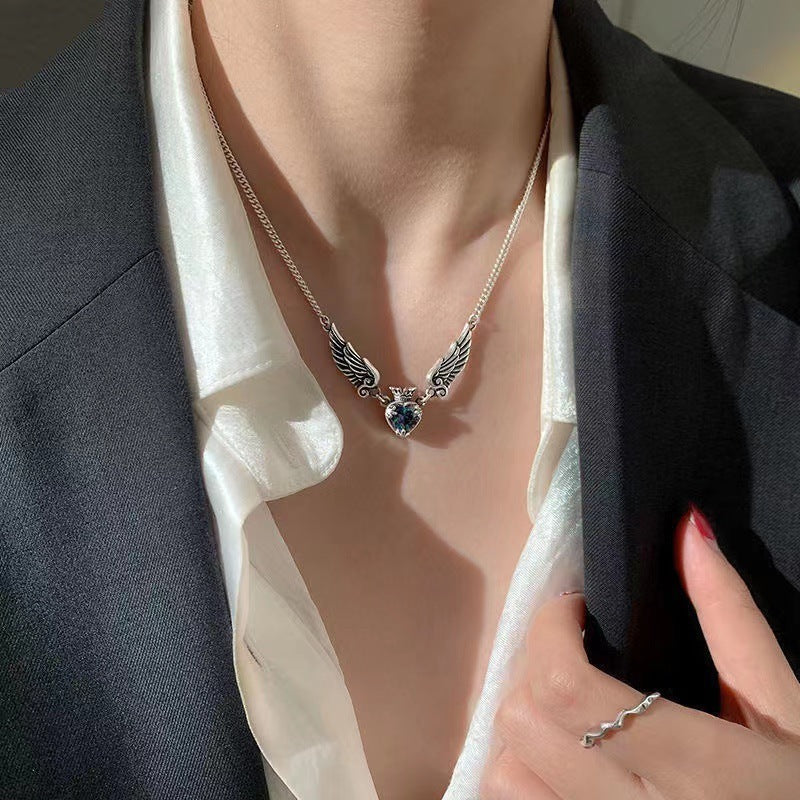 Vintage Gothic heart crown angel wings pendant necklace in silver, highlighting the clavicle with a stylish choker design.