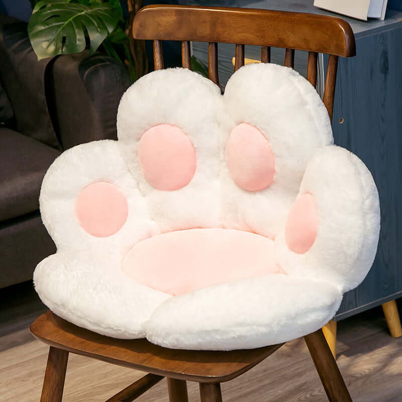 White and pink cat paw shaped plush seat cushion for kids-room on wooden chair