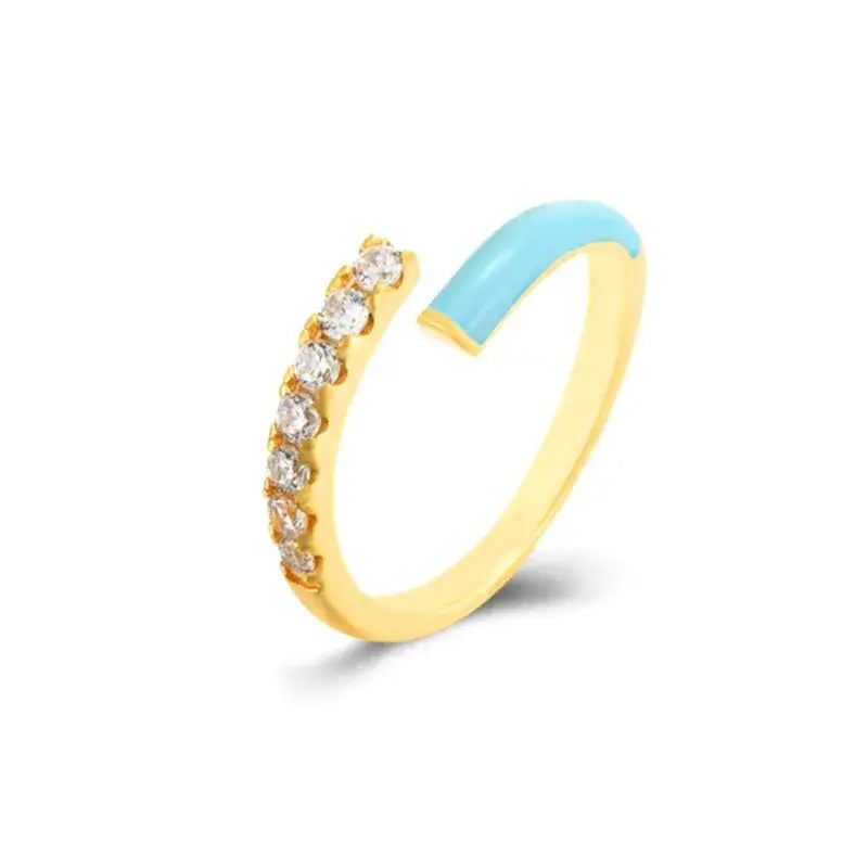 Elegant gold ring with turquoise inlay and sparkling zircon stones, perfect for sophisticated daily wear.