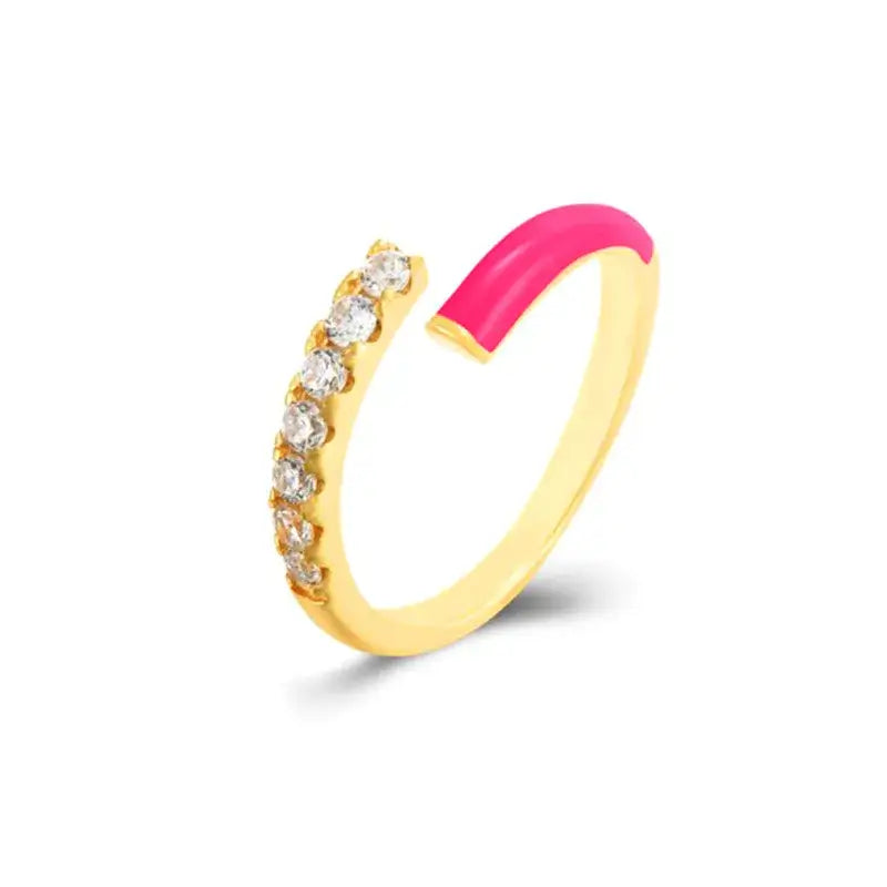 Elegant gold ring with pink accent and sparkling zircon gemstones, perfect for stylish accessorizing.
