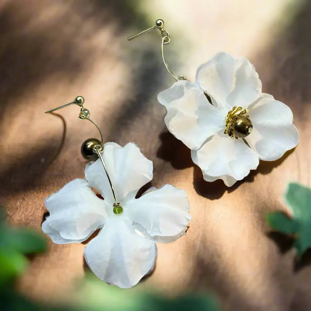 Flower Drop Earrings featuring delicate white petals, gold accents, and a lightweight design for elegant style.