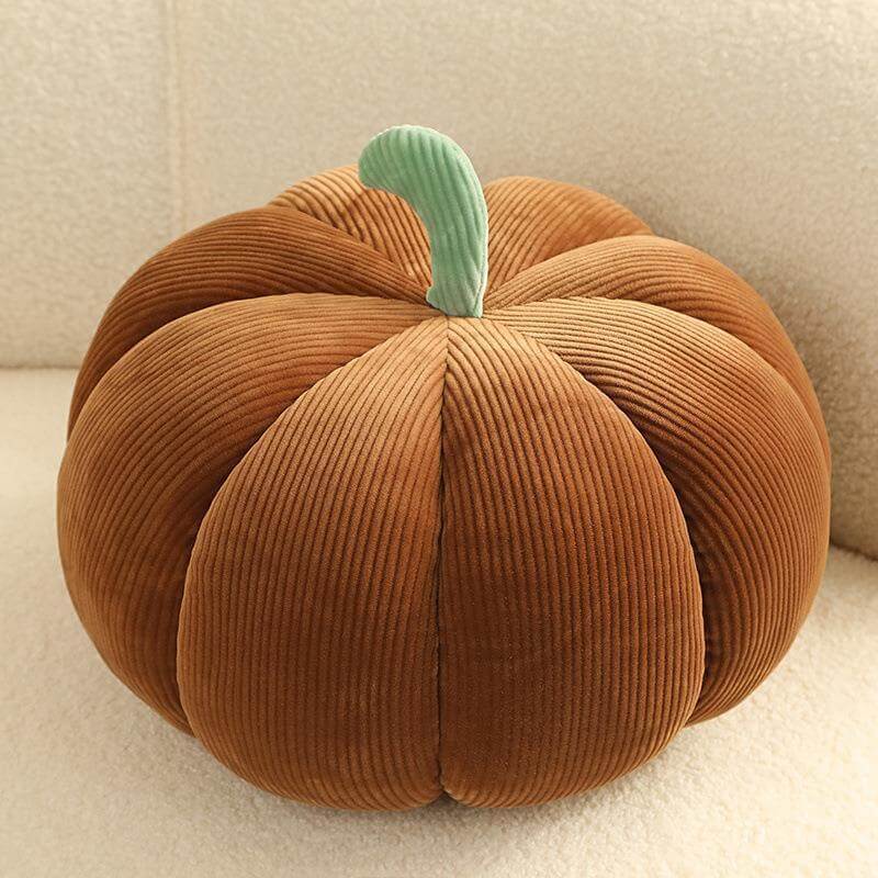 Cozy brown pumpkin-shaped throw pillow, perfect for Thanksgiving decor.