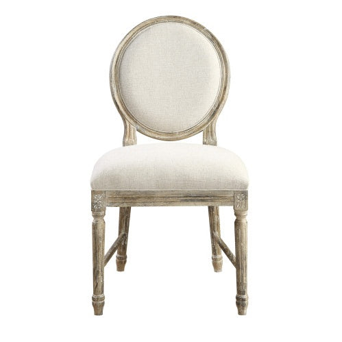 Elegant round-back dining chair with cream upholstery and distressed wood frame, perfect for modern dining rooms.