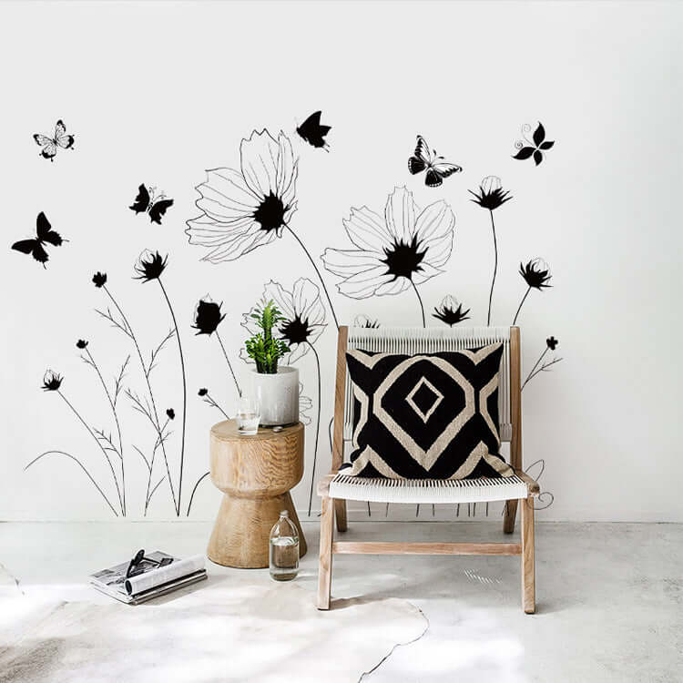 Creative flower black flower sticker wall decoration in bedroom with black and white patterned decor, butterflies, and modern design