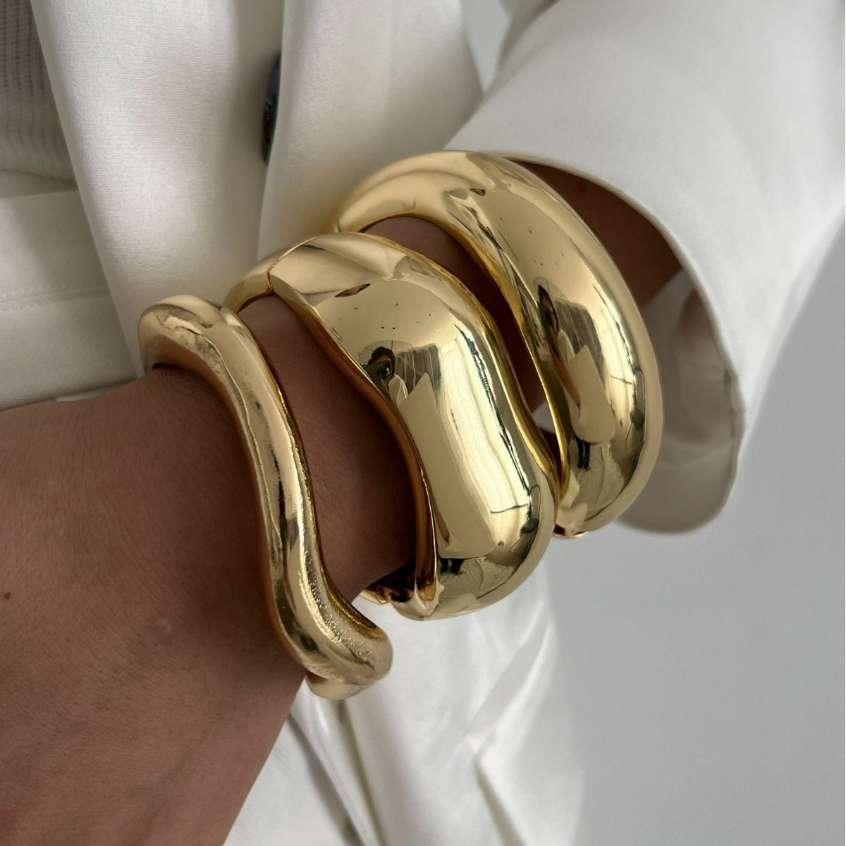 An Open-Ended Design Bracelet Wrape Around the Wrist without a Clasp Creating the Hug Effect