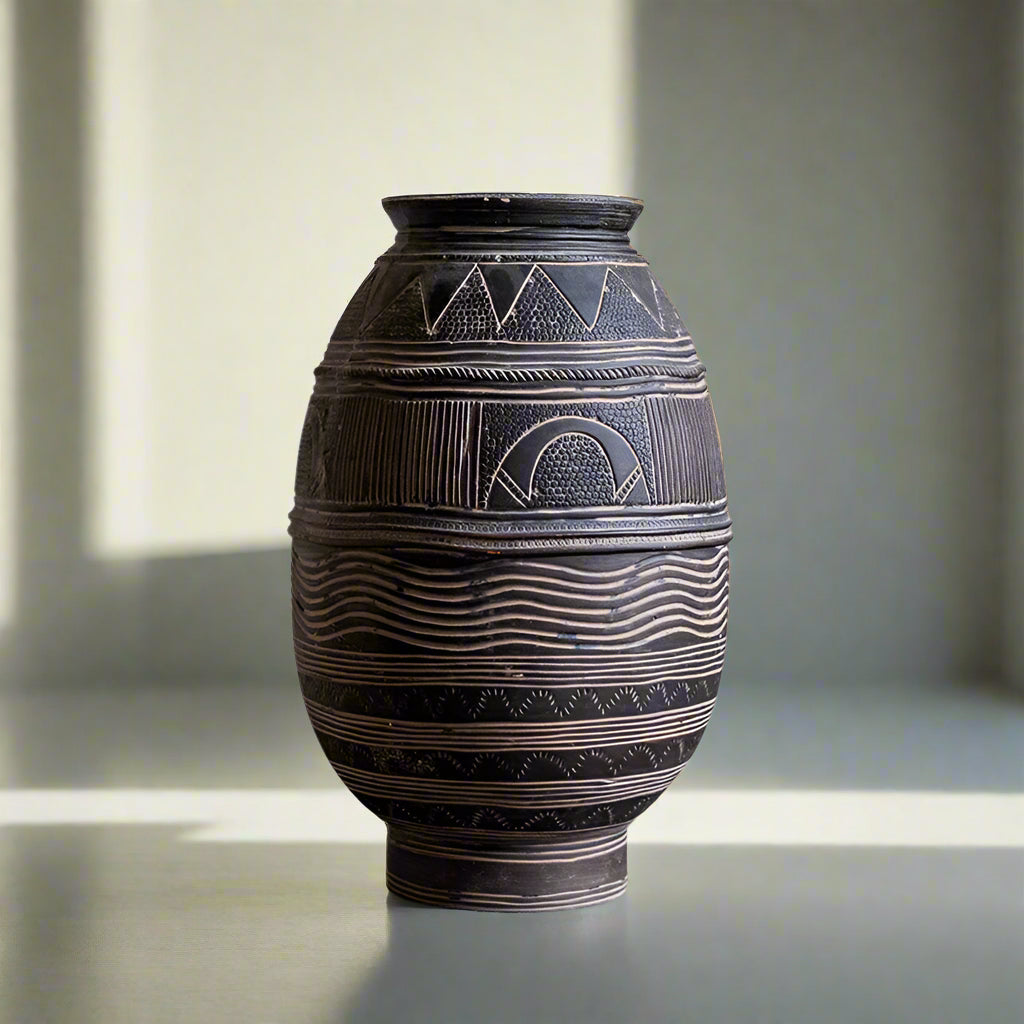 African art-inspired cement flower pot with ancient tribal patterns, perfect for home gardening decor.