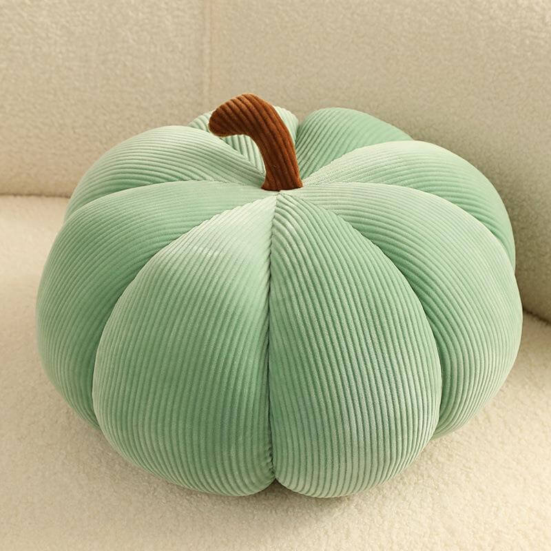 Realistic green pumpkin-shaped throw pillow with tassel weaving, perfect for modern Thanksgiving decor.